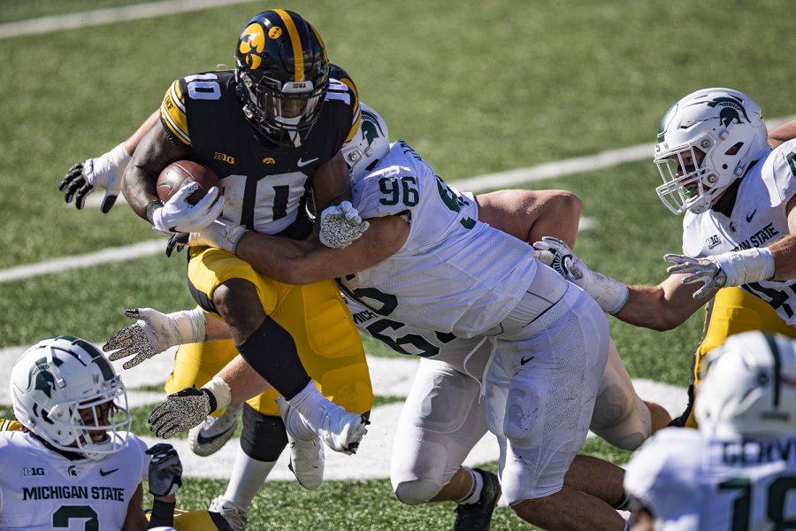 Iowa running back Mekhi Sargent carries the ball during a football game between Iowa and Michigan State in Kinnick Stadium on Saturday, Nov. 7, 2020.