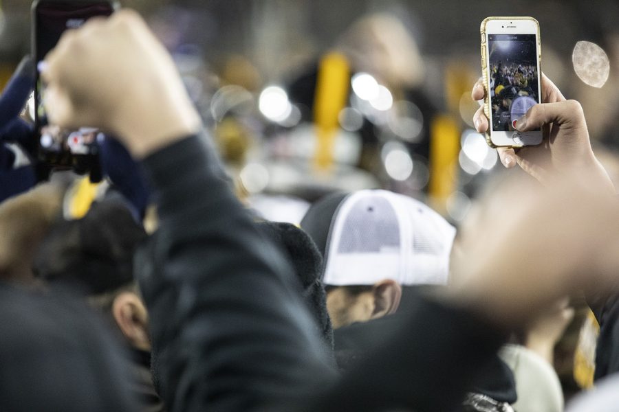 Fans celebrate on the field of Kinnick after a football game between Iowa and Minnesota on Saturday, November 16, 2019. The Hawkeyes defeated the Gophers, 23-19.