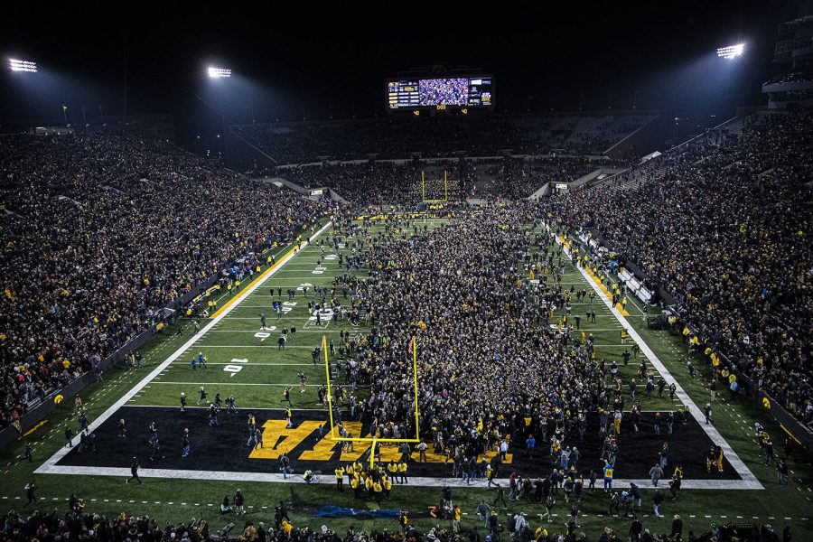 Fans storm the field during a football game between Iowa and Minnesota at Kinnick Stadium on Saturday, Nov. 16, 2019. The Hawkeyes defeated the Gophers, 23-19.