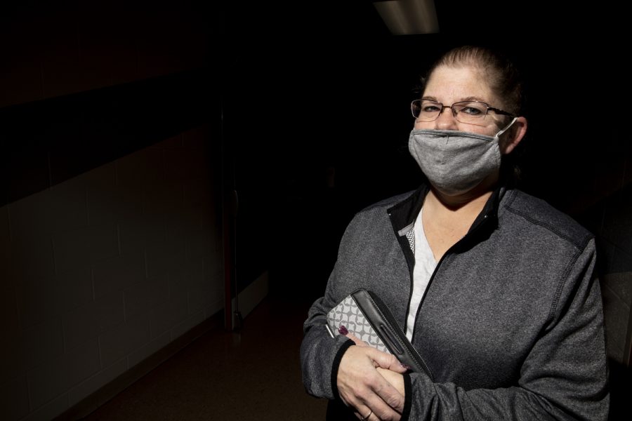North Liberty Resident Theresa Long, 48, stands for a portrait in the hallway outside a polling location at the North Liberty Community Center in North Liberty on Tuesday, November 3, 2020. Long is currently unemployed and voted based on concerns of the pandemic and passing of a stimulus package. 