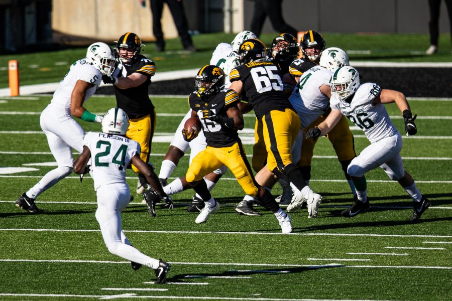 Iowa running back Tyler Goodson carries the ball during a football game between Iowa and Michigan State in Kinnick Stadium on Saturday, Nov. 7, 2020. The Hawkeyes dominated the Spartans, 49-7. 