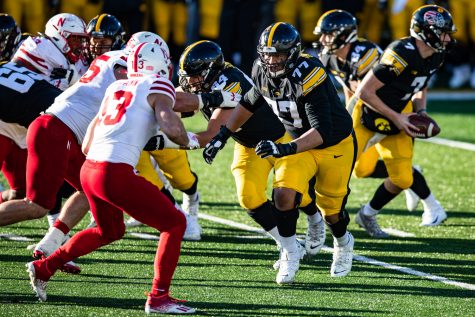 Iowa tackle Alaric Jackson throws a block during a football game between Iowa and Nebraska at Kinnick Stadium on Friday, Nov. 27, 2020. Hawkeye quarterback Spencer Petras was only sacked once on the day.