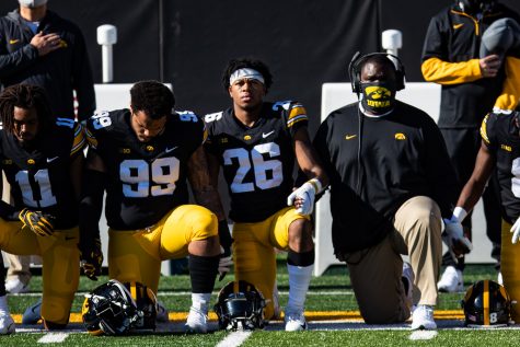 Iowas Kaevon Merriweather kneels for the anthem during a football game between Iowa and Michigan State in Kinnick Stadium on Saturday, Nov. 7, 2020. The Hawkeyes dominated the Spartans, 49-7.