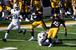 Iowa running back Tyler Goodson carries the ball during a football game between Iowa and Michigan State in Kinnick Stadium on Saturday, Nov. 7, 2020. The Hawkeyes dominated the Spartans, 49-7. Goodson and fellow back Mekhi Sargent each ran for 2 scores.