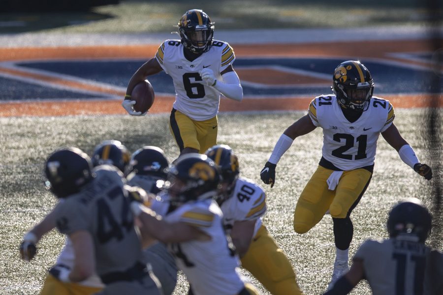 Iowa wide receiver Ihmir Smith-Marsette moves the ball upfield during the Iowa v. Illinois football game at Memorial Stadium on Saturday, Dec. 5, 2020. Iowa defeated Illinois with a final score of 35-21.