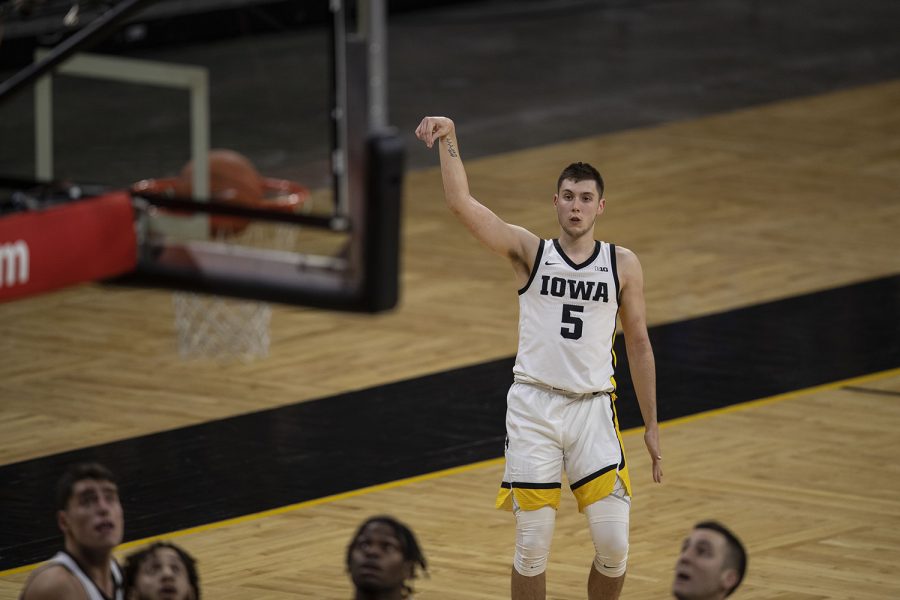 Iowa guard CJ Fredrick makes a three-point shot during the Iowa v. Western Illinois basketball game in Carver-Hawkeye Arena on Thursday, Dec. 3, 2020. Iowa defeated Western Illinois with a final score of 99-58.