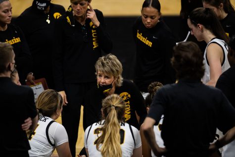Lisa Bluder, head coach of the women’s basketball team at Iowa, talks to the team during a time out at the game between Iowa and Iowa State at Carver-Hawkeye Arena on Wednesday, Dec. 9,2020. The Hawkeyes defeated the Cyclones in a close game, 82-80. 