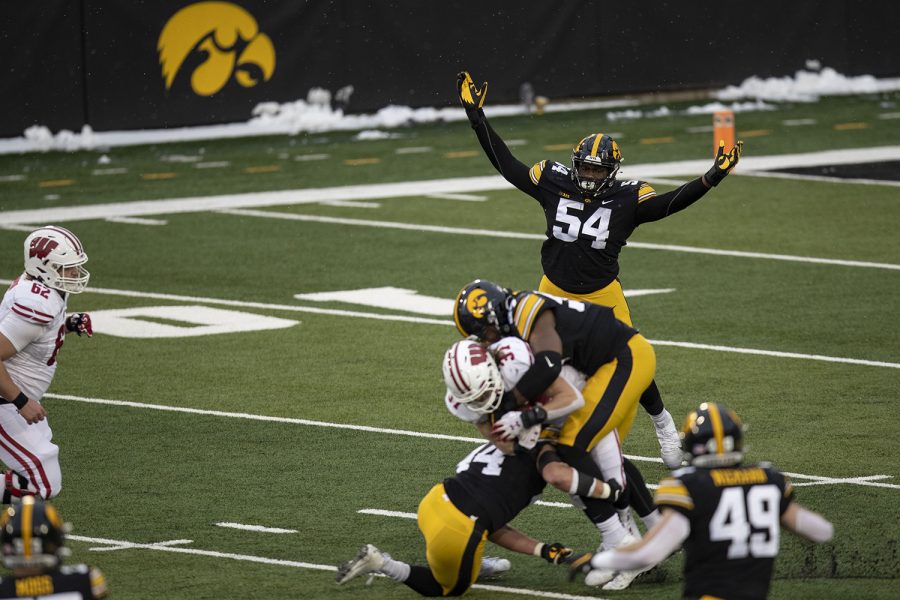Dec.+12%2C+2020%3B+Iowa+City%2C+Iowa%2C+USA%3B+Iowa+defensive+tackle+Daviyon+Nixon+%2854%29+reacts+to+the+tackle+of+Wisconsin+wide+receiver+Jordan+DiBenedetto+%2831%29+by+teammates+during+the+second+quarter+of+the+Iowa+v.+Wisconsin+football+game+at+Kinnick+Stadium.+Iowa+defeated+Wisconsin+with+a+score+of+28-7.