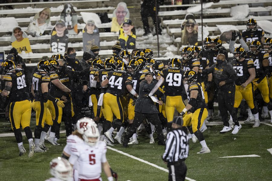 Dec. 12, 2020; Iowa City, Iowa, USA; The Iowa sideline celebrates after linebacker Jack Campbell (31) makes an interception during  the fourth quarter of the Iowa v. Wisconsin football game at Kinnick Stadium. Iowa defeated Wisconsin with a score of 28-7.
