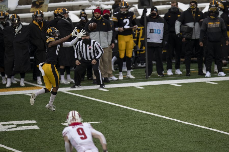Dec.+12%2C+2020%3B+Iowa+City%2C+Iowa%2C+USA%3B+Iowa+wide+receiver+Ihmir+Smith-Marsette+reaches+for+a+pass+during+the+first+quarter+of+the+Iowa+v.+Wisconsin+football+game+at+Kinnick+Stadium.+Iowa+leads+Wisconsin+with+a+score+of+6-0+at+halftime.+Mandatory+Credit%3A+Katie+Goodale%2FDaily+Iowan+via+USA+TODAY+Network