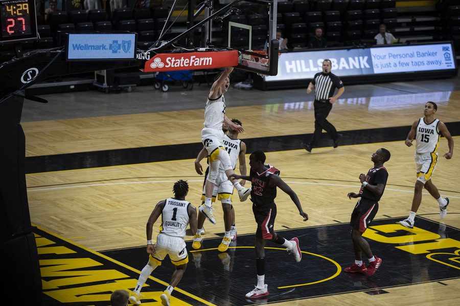 Iowa forward Patrick McCaffery dunks the ball during a basketball game against Northern Illinois on Sunday, Dec. 13, 2020 at Carver Hawkeye Arena. The Hawkeyes defeated the Huskies, 106-53.