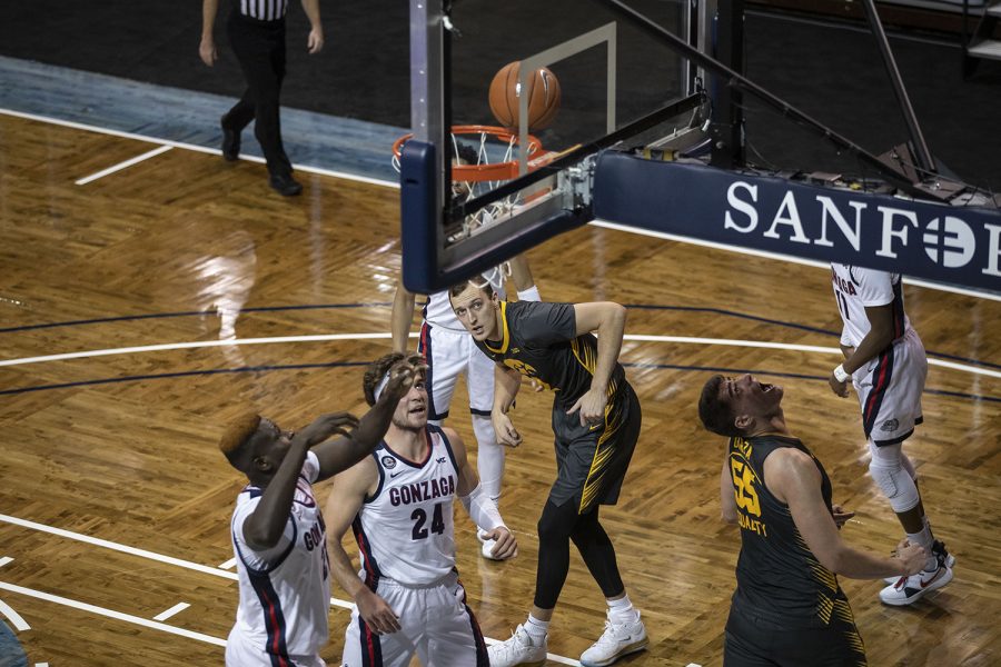 Saturday, Dec. 19, 2020; Sioux Falls, South Dakota, USA;  Iowa forward Jack Nunge (2) and Iowa center Luka Garza (55) watch as the ball spins on the rim of the net during the first half of the Iowa v. Gonzaga basketball game at the Sanford Pentagon. Gonzaga leads against Iowa with a score of 51-37 after the first half. Mandatory Credit: Katie Goodale/Daily Iowan via USA TODAY Network