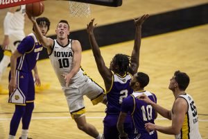 Iowa Forward Joe Wieskamp jumps for a basket during the Iowa v. Western Illinois basketball game in Carver-Hawkeye Arena on Thursday, Dec. 3, 2020. Iowa defeated Western Illinois with a final score of 99-58.