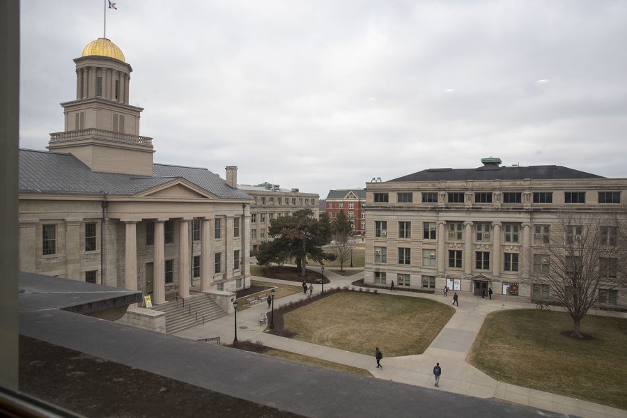 Students walk on the Pentacrest on Wednesday, March 11, 2020. The university will be suspending classes until at least April 3, 2020 and will be moving instruction online amidst concerns around coronavirus.