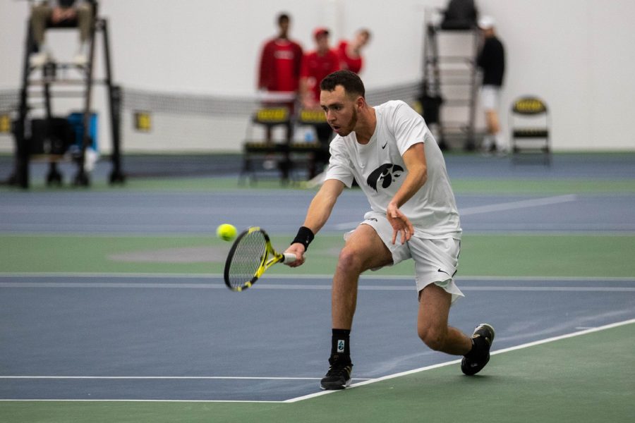Kareem Allaf hits a backhand during a men's tennis match between Iowa and Cornell at the HTRC on Sunday, Mar. 8, 2020. Iowa defeated Cornell 4-3. 