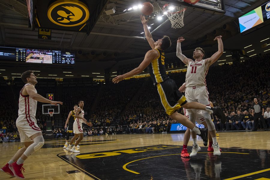 Iowa center Luka Garza shoots a reverse layup during a basketball game between Iowa and Wisconsin on Monday, Jan. 27, 2020 at Carver Hawkeye Arena. The Hawkeyes defeated the Badgers, 68-62. (Hannah Kinson/The Daily Iowan.)