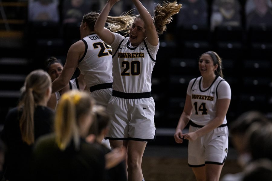 Iowa Guard Kate Martin and Forward Monika Czinano participate in the introductions during a women’s basketball game between Iowa and Wisconsin at Carver Hawkeye Arena on Saturday, December 5, 2020. The Hawkeyes defeated the Badgers 85-78. 