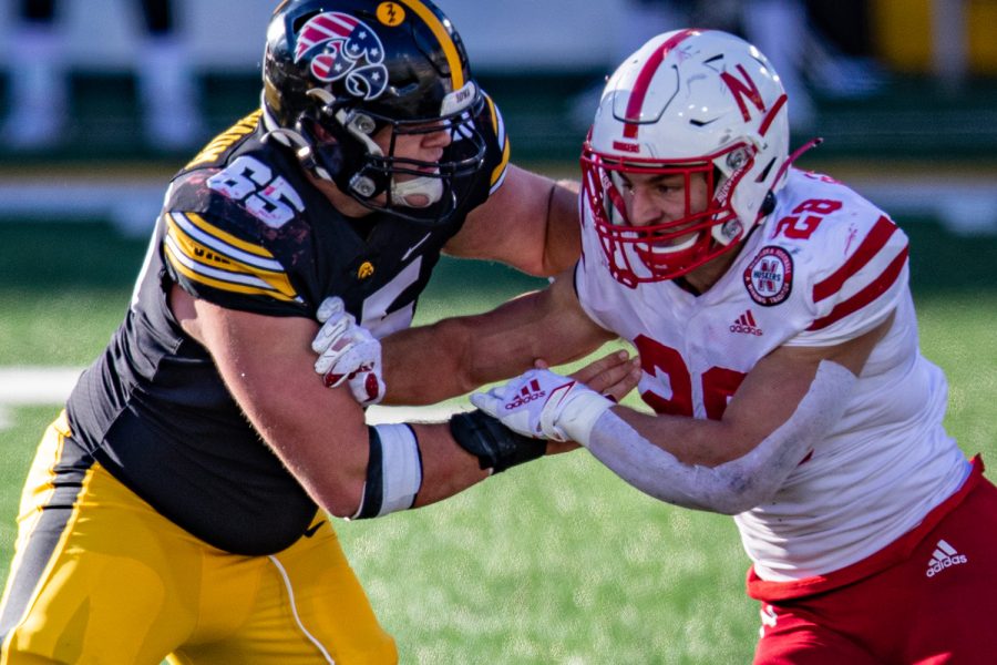 Iowa center Tyler Linderbaum throws a block during a football game between Iowa and Nebraska at Kinnick Stadium on Friday, Nov. 27, 2020. The Hawkeyes defeated the Cornhuskers, 26-20. (Shivansh Ahuja/The Daily Iowan)