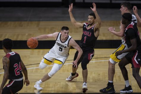 Iowa guard CJ Fredrick dribbles the ball during a basketball game against Northern Illinois on Sunday, Dec. 13, 2020 at Carver Hawkeye Arena. The Hawkeyes defeated the Huskies, 106-53. 
