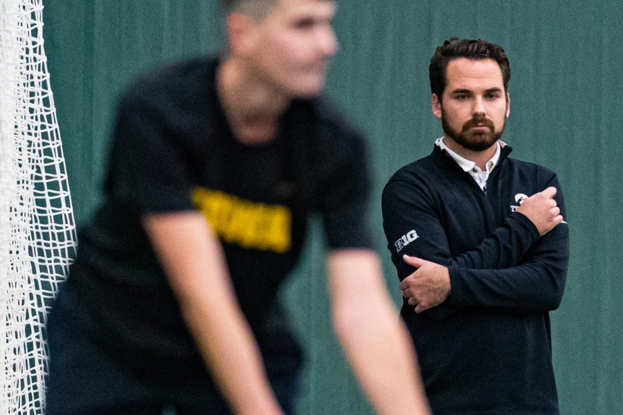 Iowa head coach Ross Wilson watches his team during a men's tennis match between Iowa and Texas Tech at the HTRC on Thursday, Jan. 16, 2020. The Red Raiders defeated the Hawkeyes, 4-3. 
