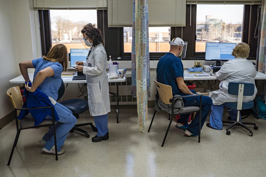 Pharmacists and nurses prepare to administer a COVID-19 vaccine at the VA Health Care System in Iowa City on Tuesday, Dec. 22, 2020. The center received the Moderna vaccine for its employees. 