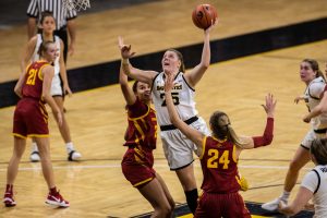 Iowa player Monika Czinano goes up for a basket during a women’s basketball game between Iowa and Iowa State at Carver-Hawkeye Arena on Wednesday, Dec. 9, 2020. The Hawkeyes defeated the Cyclones in a close game, 82-80. 