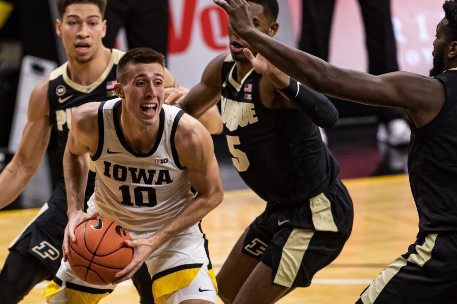 Iowa guard Joe Wieskamp looks to pass against Purdue at Carver-Hawkeye Arena on Tuesday.