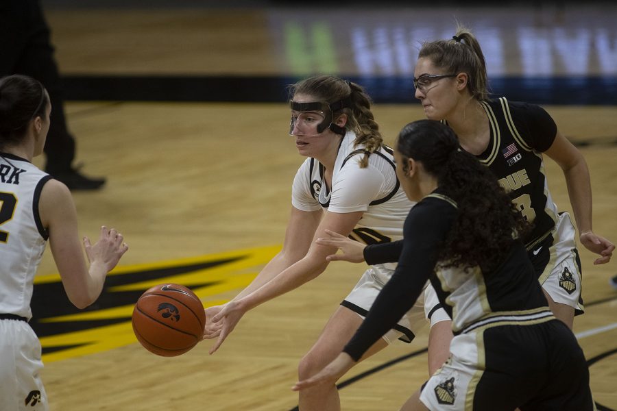 Iowa guard Kate Martin passes the ball during a women's basketball game against Purdue on Monday, Jan. 18, 2021 at Carver Hawkeye Arena. The Hawkeyes defeated the Boilermakers 87-81.