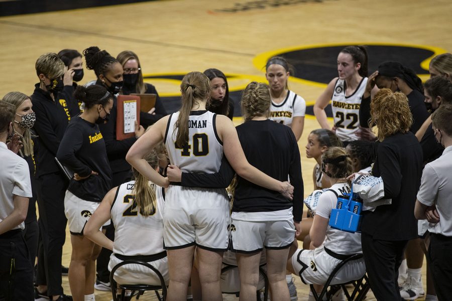 Iowa+center+Sharon+Goodman+and+forward+Shateah+Wetering+stand+together+during+a+timeout+for+a+womens+basketball+game+against+Purdue+on+Monday%2C+Jan.+18%2C+2021+at+Carver+Hawkeye+Arena.+The+Hawkeyes+defeated+the+Boilermakers+87-81.