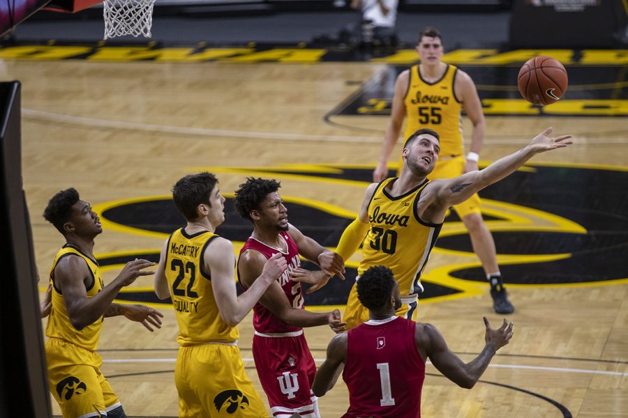 Iowa guard Connor McCaffery reaches for a rebound during a mens basketball game against Indiana on Thursday, Jan. 21, 2021 at Carver Hawkeye Arena. The Hawkeyes were defeated by the Hoosiers, 69-81.