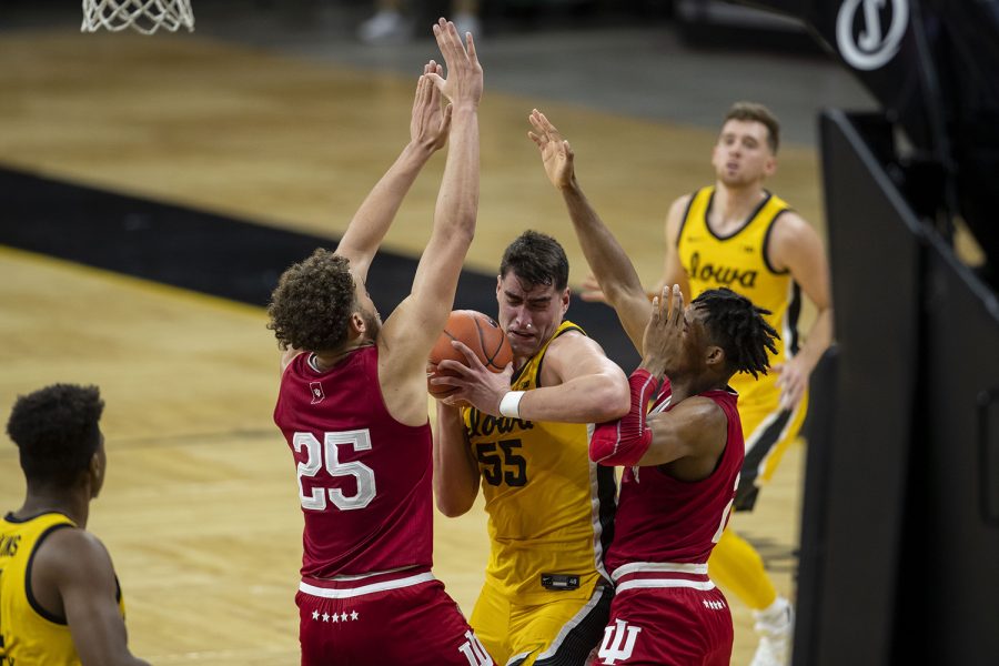 Iowa forward Luka Garza gets blocked by Indiana forward Race Thompson during the first half of a mens basketball game against Indiana on Thursday, Jan. 21, 2021 at Carver Hawkeye Arena. The Hawkeyes are leading over the Hoosiers, 37-31.