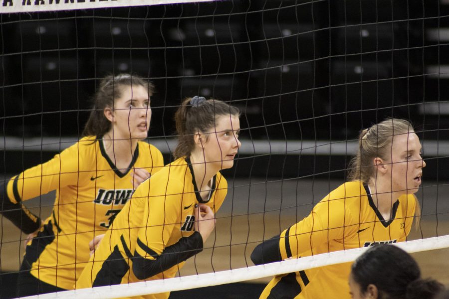 Iowa players watch the ball as Illinois serves it over the net during the volleyball match between Illinois and Iowa on Saturday Jan 23, 2021 at Carver Hawkeye Arena. The Hawkeyes were defeated by the Fighting Illini, 3-1.