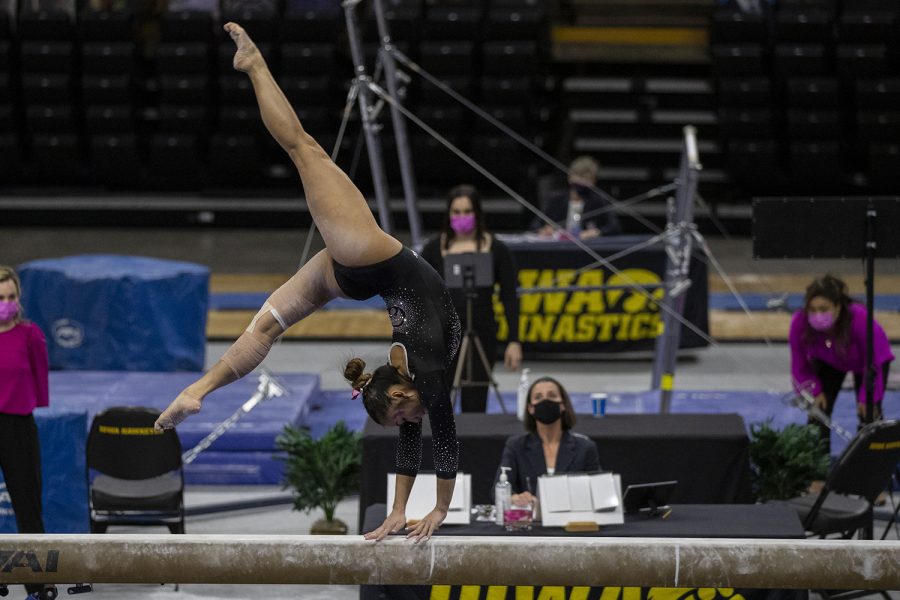 Iowas+all-around+Adeline+Kenlin+performs+on+the+beam+during+a+gymnastics+meet+against+Ohio+State+on+Saturday%2C+Jan.+23%2C+2021+at+Carver+Hawkeye+arena.+The+Hawkeyes+defeated+the+Buckeyes+with+a+score%2C+196.550-193.800.+Kenlin+earned+a+score+of+9.825.