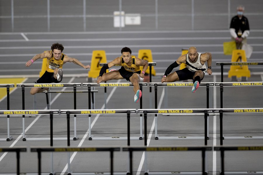 Iowa hurdlers Gratt Reed, Jamal Britt, and Iowa alum Aaron Mallett compete in the 60m hurdle premier final during the second day of the Larry Wieczorek Invitational on Saturday, Jan. 23, 2021 at the University of Iowa Recreation Building. Reed, Britt, and Mallett finished fifth, second, and first, respectively. Due to coronavirus restrictions, the Hawkeyes could only host Big Ten teams. Iowa men took first, scoring 189, and women finished third with 104 among Minnesota, Wisconsin, Nebraska, and Illinois. 