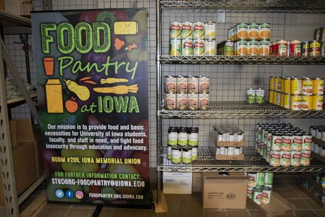 Can goods slowly fill the shelf at the U of Iowa food pantry, on Friday, Jan 22, 2021. 
