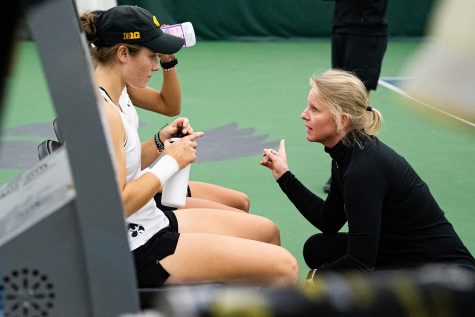 Iowa head coach Sasha Schmid talks to her team during a womens tennis match between Iowa and Colorado at the HTRC on Sunday, Feb. 16, 2020. 