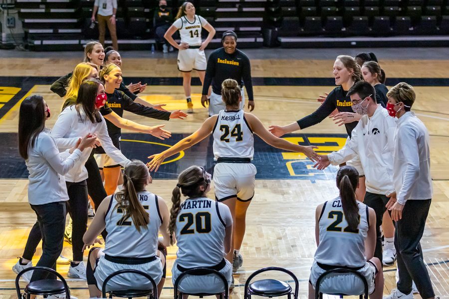 Iowa Guard Gabbie Marshall claps hands with her team as she runs onto the court as one of Iowa’s starters before the Iowa Women’s Basketball game against Northwestern on Jan. 28, 2021 at Carver-Hawkeye Arena. Northwestern defeated Iowa 87-80