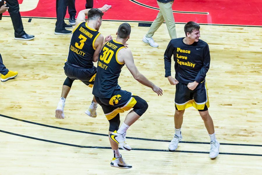 Iowa Guard Jordan Bohannon and Iowa Guard/Forward Connor McCaffery celebrate their first win of the new year after the buzzer went off during the Iowa vs. Rutgers Men’s Basketball game on Jan. 2, 2021. The Iowa Hawkeyes defeated the Rutgers Scarlet Knights 77-75. 