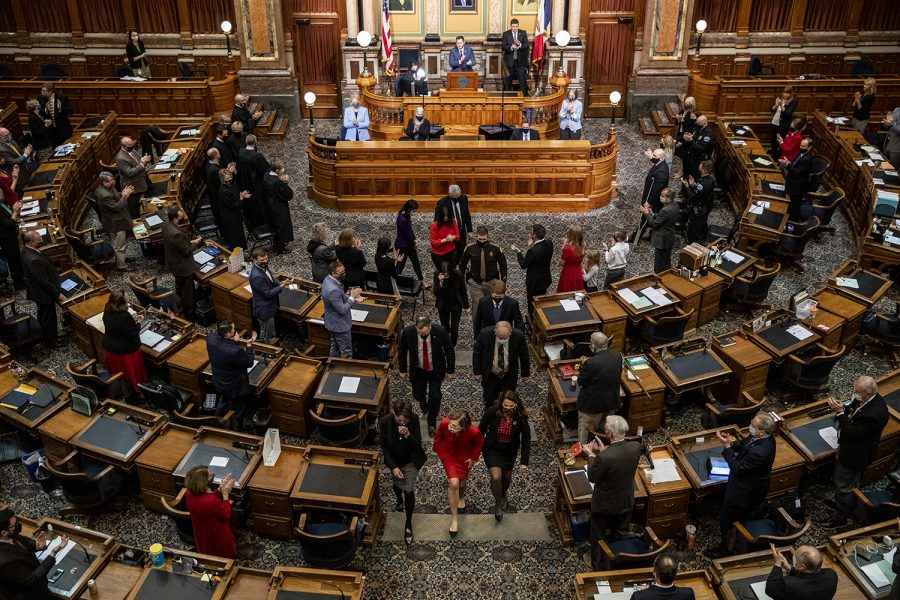 Legislative members and attendees applaud as Kim Reynolds exits the house chamber following the State of the State address in the Iowa State Capitol on Tuesday, Jan. 12, 2021 in Des Moines. Gov. Reynolds highlighted in the address expansion of broadband internet, a push for in-person learning, and economic recovery from the COVID-19 pandemic. 