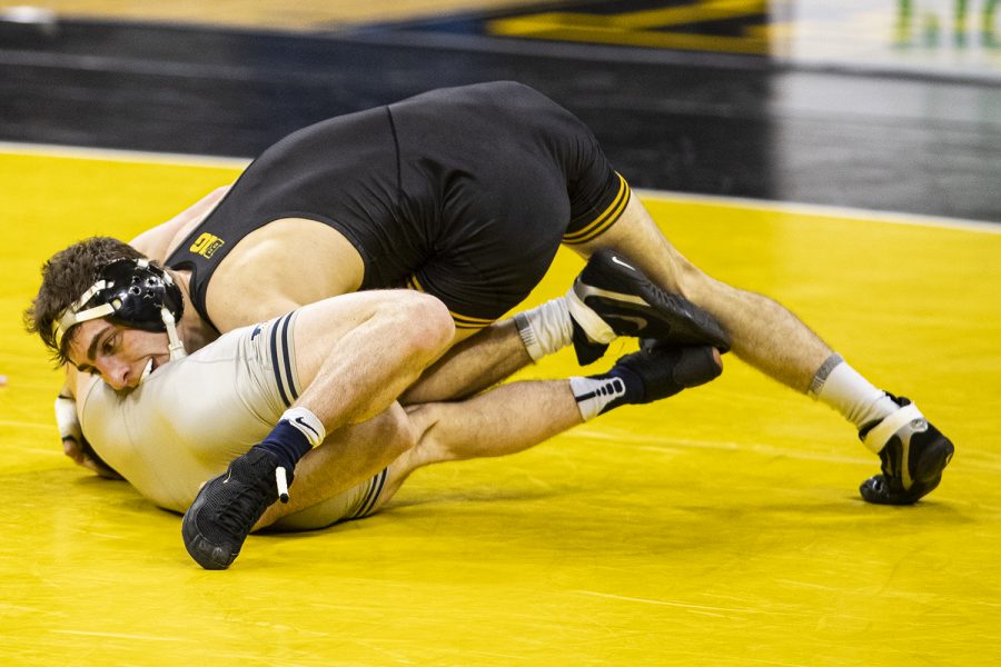 IowaÕs 133-pound Austin DeSanto grapples with IllinoisÕ Lucas Byrd during a wrestling dual meet between Iowa and Illinois at Carver-Hawkeye Arena on Sunday, Jan. 31, 2021. No. 4 Austin DeSanto defeated No. 23 Lucas Byrd by major decision, 18-6.