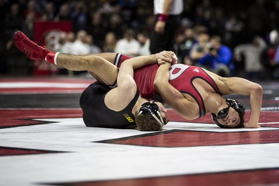 Iowas 125-pound Spencer Lee grapples with Rutgers  Nicolas Aguilar during session one of the Big Ten Wrestling Tournament in Piscataway, NJ on Saturday, March 7, 2020. Lee won by fall in 2:53. (Nichole Harris/The Daily Iowan)