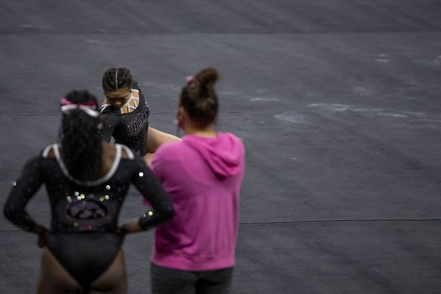 Iowas Clair Kaji gets ready to perform her floor routine during a gymnastics meet against Ohio State on Saturday, Jan. 23, 2021 at Carver Hawkeye arena. The Hawkeyes defeated the Buckeyes with a score, 196.550-193.800. Kaji earned a score of 9.925.