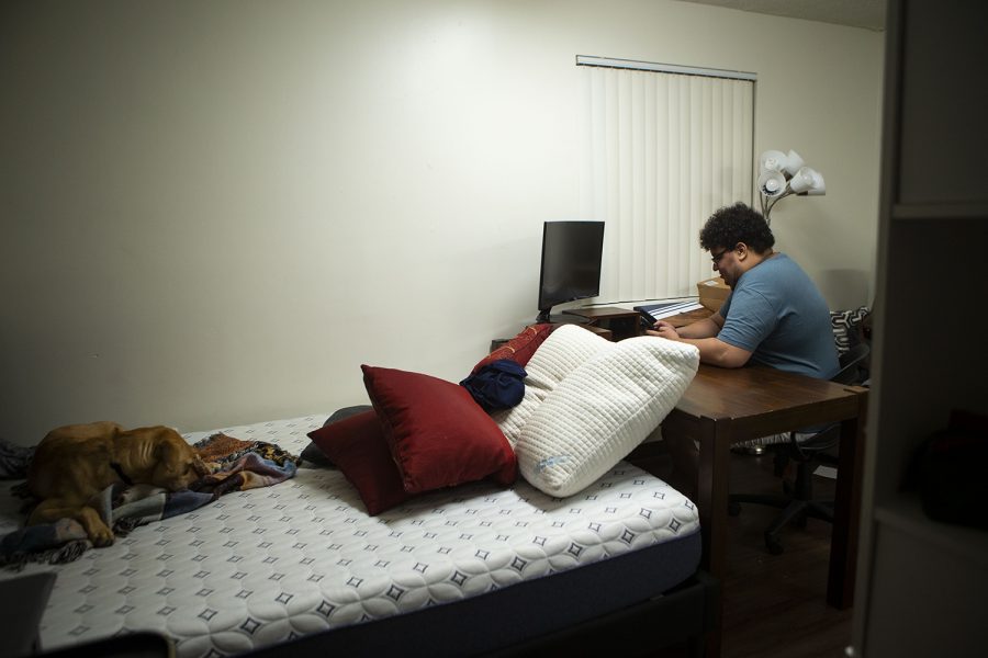 Florida International University student Javon Stovall unpacks in his new apartment on campus on Thursday, Dec. 31, 2020. Stovall graduated from the University of Iowa in May before moving to Miami, FL.