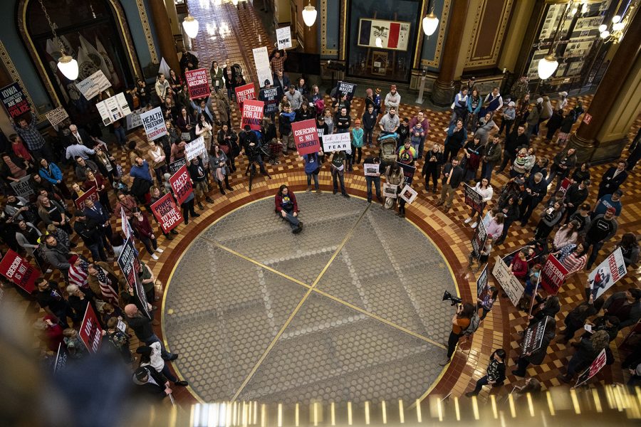 Anti-mask protestors stand in the rotunda of the Iowa State Capitol Building before the opening of the legislative session on Monday, Jan. 11, 2021. (Ryan Adams/The Daily Iowan)