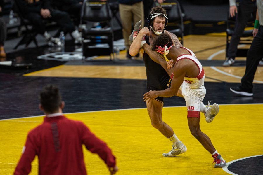 IowaÕs 141-pound Jaydin Eierman grapples with NebraskaÕs Chad Red, Jr. during a wrestling dual meet between No. 1 Iowa and No. 6 Nebraska at Carver Hawkeye Arena on Friday, Jan. 15, 2021.