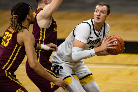 Iowa forward Jack Nunge looks to pass during a mens basketball game between Iowa and Minnesota at Carver-Hawkeye Arena on Sunday, Jan. 10, 2021. The Hawkeyes defeated the Golden Gophers, 86-71.