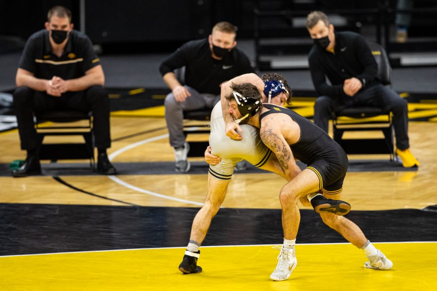 Iowa%E2%80%99s+141-pound+Jaydin+Eierman+grapples+with+Illinois%E2%80%99+Dylan+Duncan+during+a+wrestling+dual+meet+between+Iowa+and+Illinois+at+Carver-Hawkeye+Arena+on+Sunday%2C+Jan.+31%2C+2021.+No.+1+Eierman+defeated+No.+13+Duncan+by+tech+fall+in+6%3A05%2C+and+the+Hawkeyes+defeated+the+Fighting+Illini%2C+36-6.