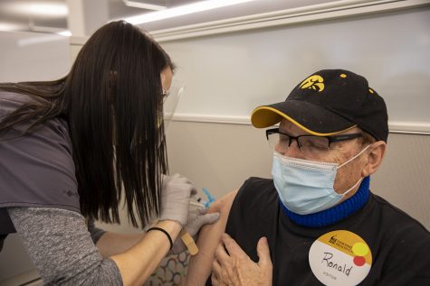 Community vaccinations given on Wednesday, Feb. 3, 2021. Ronald See closes his eyes as Kristen Van Scoyoc RN administers the vaccine. See said he was glad to finally get it.