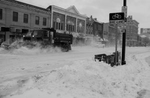 A snow plow shovels snow on Clinton Street in Iowa City on Thursday, Feb. 4, 2021. A winter storm warning was issued for eastern Iowa. 