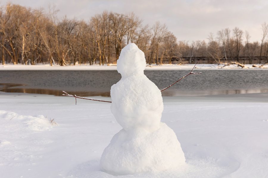 A snowman is seen on the Iowa River after a snowfall in Coralville on Feb. 4, 2021.